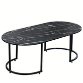 Elegant Oval Black Marble Coffee Table with black metal legs, perfect for modern living room decor.