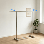 Double Rail Retractable Clothes Rack with Wheels in a modern room, showcasing its expandable design for efficient space use.