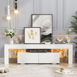 White TV console with two drawers and warm LED-lit side shelves in a bright lounge