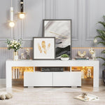 White TV console with two drawers and warm LED-lit side shelves in a bright lounge
