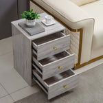 Modern 3-Drawer Nightstand with gold handles set beside a sofa, showcasing three spacious drawers for storage.