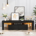 Black 160cm LED TV stand with two drawers and warm-lit glass shelves