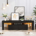 Black 160cm LED TV stand with two drawers and warm-lit glass shelves