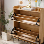 Rattan Flip-Top Shoe Cabinet featuring elegant storage slots in a stylish entryway setting.