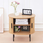 Chic round side table with sliding doors used as sofa end table