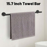 Matte Black Bathroom Towel Rack Set - 15.7 Inch Towel Bar with towel hanging on it.