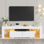 White LED TV unit with warm yellow lighting beneath a wall-mounted television