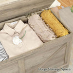 Rustic Wooden Storage showing huge storage space with neatly folded clothes inside a wooden storage bench.