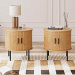 Two round side tables with storage used as bedroom nightstands