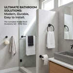 Matte Black Bathroom Towel Rack Set displayed in a modern bathroom featuring towel bar, towel ring, and hooks.