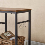 Close-up of practical side hooks on industrial TV stand for headphones storage
