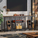 Heavy-duty industrial TV stand organizing media devices and stereo speakers