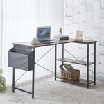 Reversible L-Shaped Computer Desk with laptop, storage basket, and stylish rustic design perfect for home office.