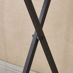 Close-up of the sturdy X-shaped support of a rustic folding TV tray table.