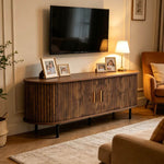 Mid-Century media console with tambour doors styled in contemporary living room