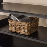 TV Stand with Charging Station featuring a woven basket holding magazines and a remote in a neatly organized shelf.