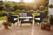 Black PE rattan 4-piece patio furniture set with white cushions for South African garden