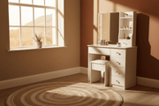 White dressing table beside window with warm South African sunlight in bedroom