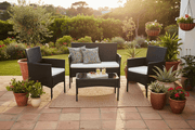 Black PE rattan 4-piece patio furniture set with white cushions for South African garden