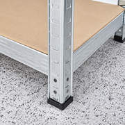 Close-up of stable black foot on metal shelving unit