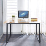 150cm office desk workstation with large desktop, computer, and decorative items in a bright office setting.
