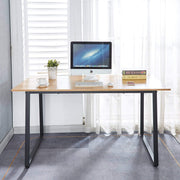 150cm office desk workstation with large desktop, computer, and decorative items in a bright office setting.