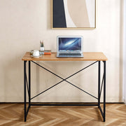 Minimalist Computer Desk with X-Frame Design featuring a laptop and coffee cup, ideal for home office and study.