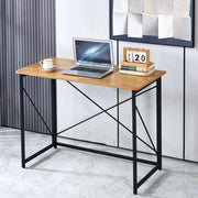 Minimalist Computer Desk with X-Frame Design featuring a laptop, coffee cup, and decorative calendar.