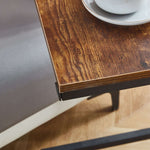 Close-up of the wooden surface of a Side End Table Coffee Table Bedside Table with a cup and saucer.