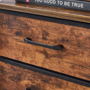 Wooden drawer with a black handle on a wooden surface.
