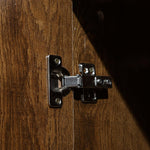Metal hinge on a wooden surface | Artisansa SA