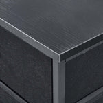 Close-up of a black metal frame with a textured surface | Artisansa SA