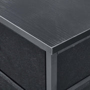 Close-up of a black metal frame with a textured surface | Artisansa SA