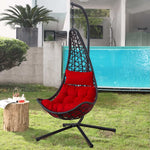 Hammock swing chair F95 with red cushion on a grassy area near a pool | Artisansa SA