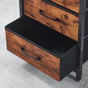 Wooden storage unit with black interior and metal handles on a light gray floor.