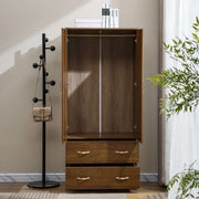 Wooden wardrobe with open doors in a room with a coat rack and plant. | Artisansa SA