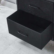 Black drawer with handles on a light gray floor | Artisansa SA