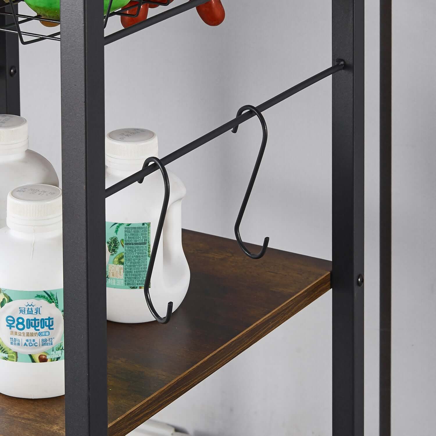 Kitchen Baker's Rack featuring hooks and bottles on a wooden shelf for organized storage.