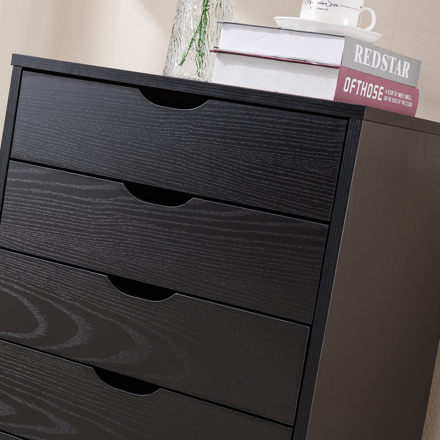 Black Bedside Table with Drawers featuring four spacious drawers and a tidy top surface for minimalistic bedroom decor.