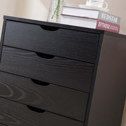 Black Bedside Table with Drawers featuring four spacious drawers and a tidy top surface for minimalistic bedroom decor.