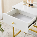 Close-up of open storage drawer on white and gold dressing table