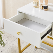 Close-up of open storage drawer on white and gold dressing table