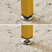 Adjustable foot pads on gold metal dressing table legs
