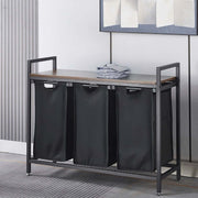 3-Compartment Laundry Sorter with Wood Shelf in a modern laundry room, featuring three fabric compartments for organizing laundry.