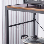 3-Tier Bakers Rack with hooks and a pot placed underneath, showcasing practical kitchen organization.