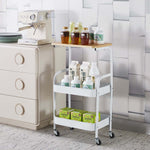 3-Tier Rolling Storage Cart with Wood Top displaying various bottles and jars on a stylish kitchen countertop.