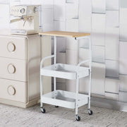 3-Tier Rolling Storage Cart with Wood Top placed next to a coffee machine and a beige dresser.
