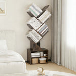 Freestanding Tree Bookshelf with Cabinet showcasing books and decorative items in a minimalist living space.