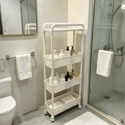 4-Tier Rolling Storage Cart in a modern bathroom, holding toiletries and towels, showcasing practical organization.