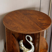 Smooth top surface of 5-tier rotating bookshelf displaying decorative swan